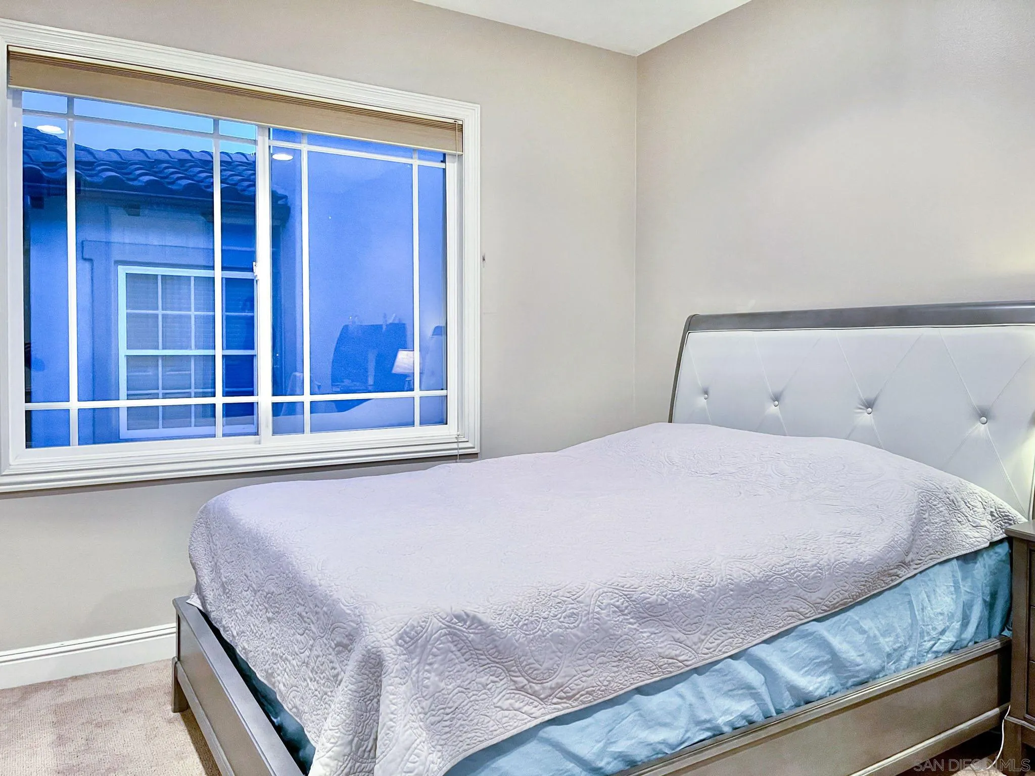 694 Cypress Hills Drive Encinitas, CA 92024 - Photo 37 of 49 a bedroom with a bed and window