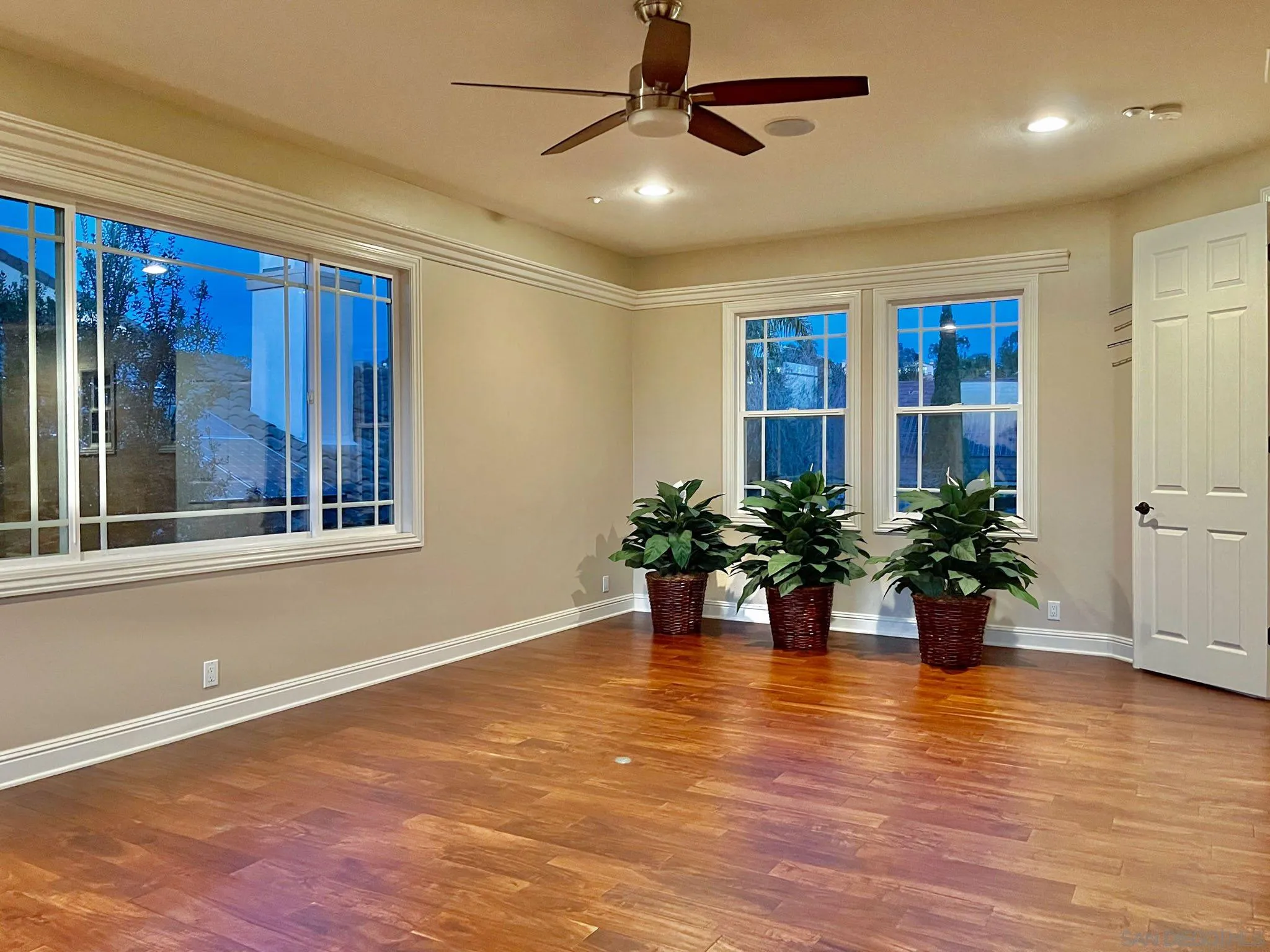 694 Cypress Hills Drive Encinitas, CA 92024 - Photo 38 of 49 a view of an empty room with window and wooden floor