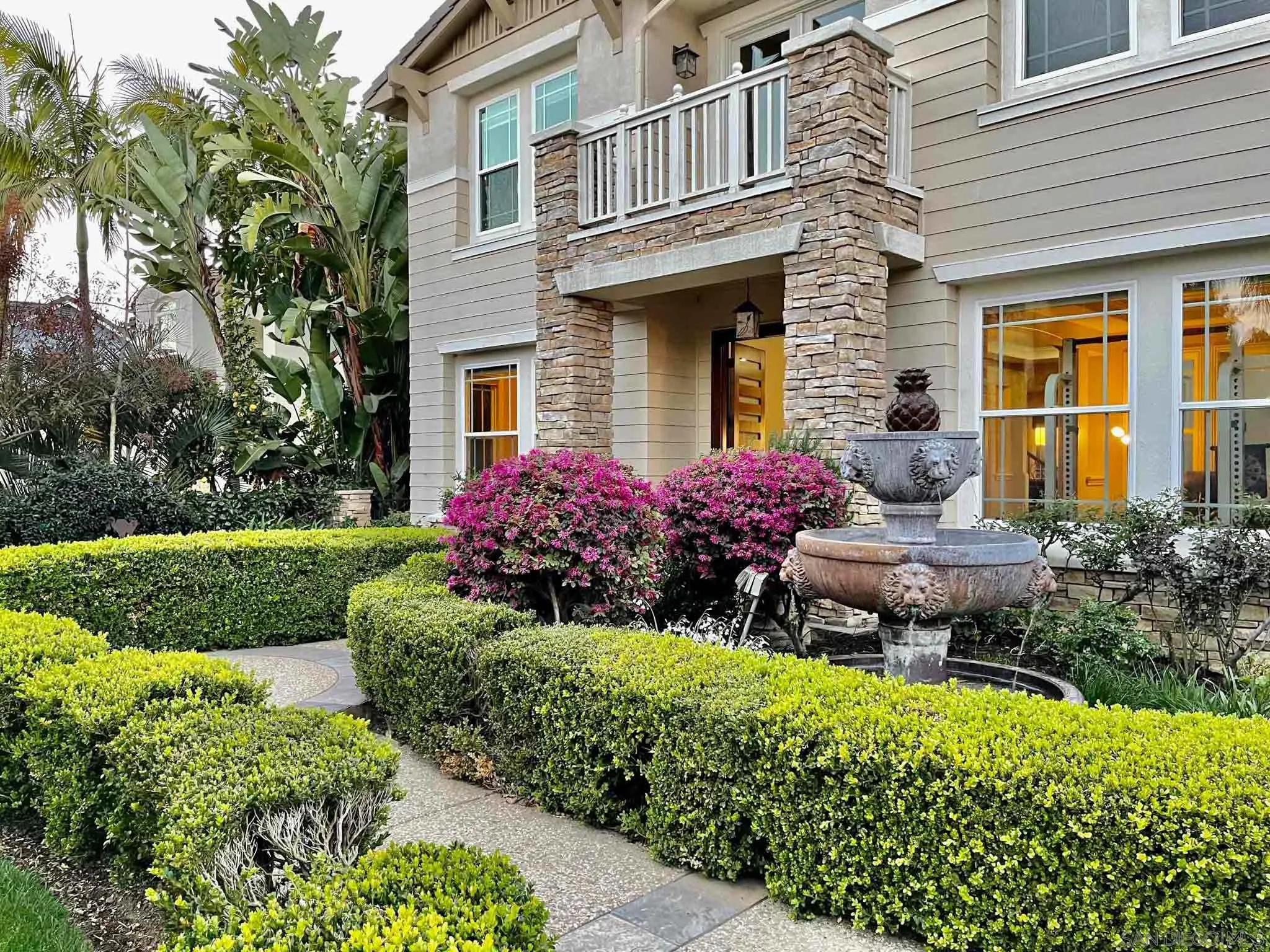 694 Cypress Hills Drive Encinitas, CA 92024 - Photo 4 of 49 a view of a house with a yard and potted plants