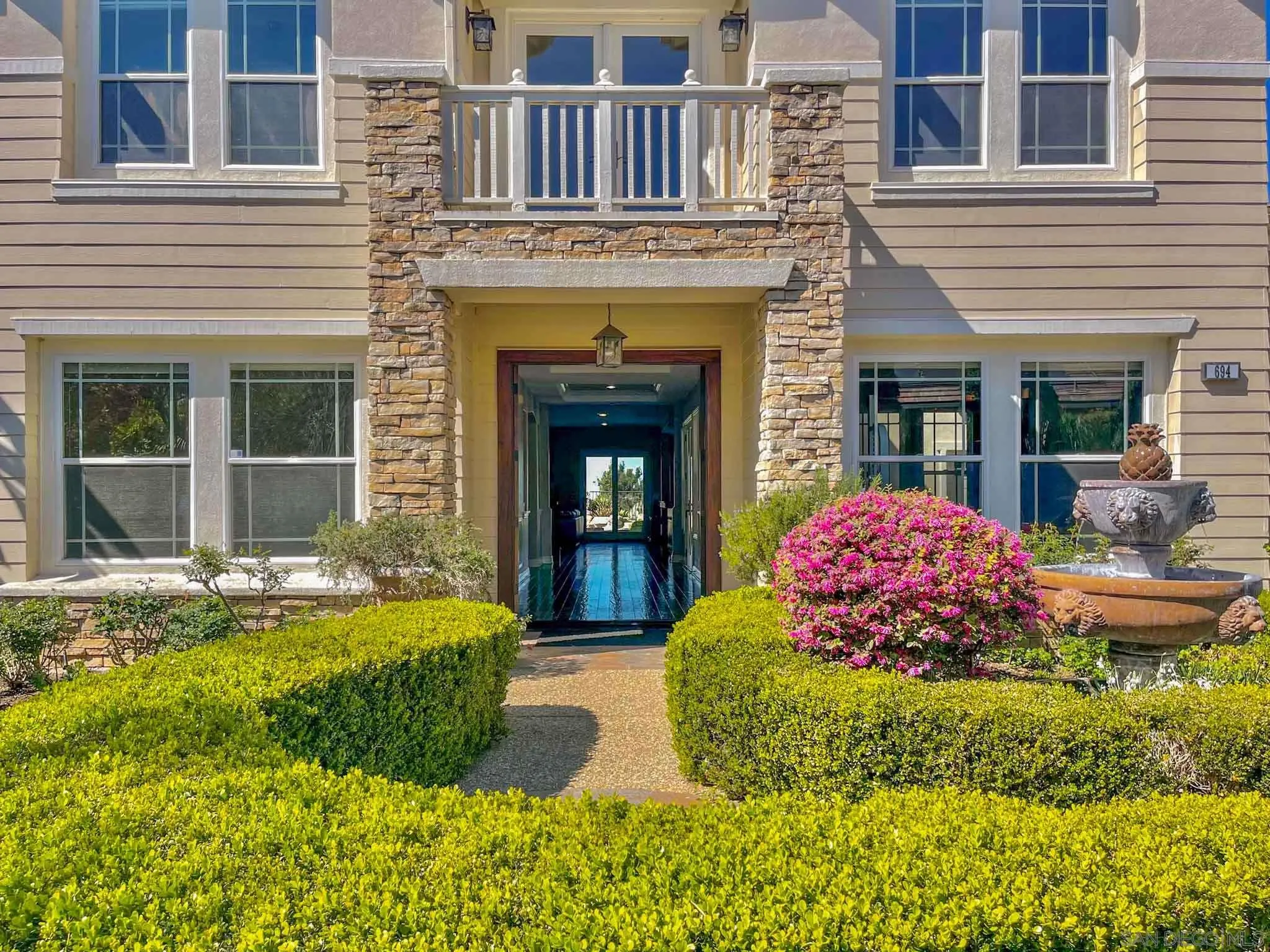 694 Cypress Hills Drive Encinitas, CA 92024 - Photo 6 of 49 a front view of a house with swimming pool