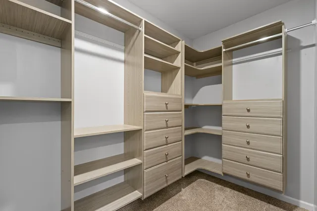 a view of an empty walk in closet