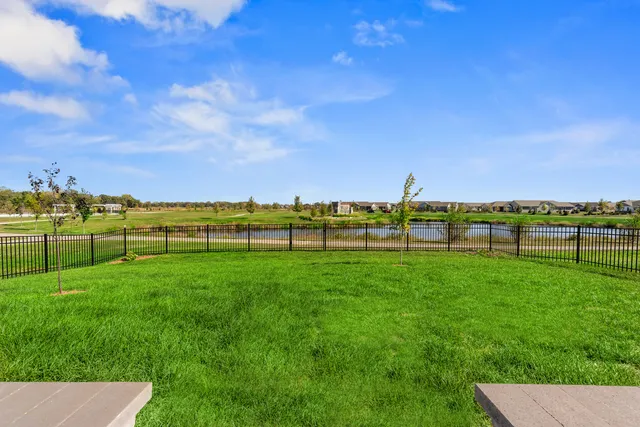 a view of a lake with a big yard