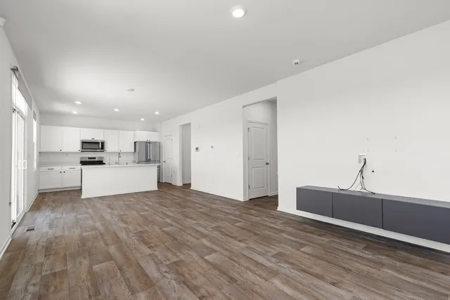 a view of kitchen with wooden floor