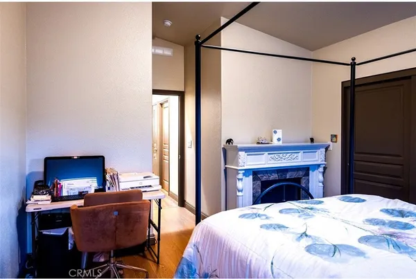a bathroom with a granite countertop sink a toilet and mirror