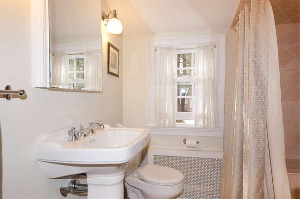 24 Colby Road Wellesley, MA 02482 - Photo 12 of 16 a bathroom with a bathtub shower sink and a toilet