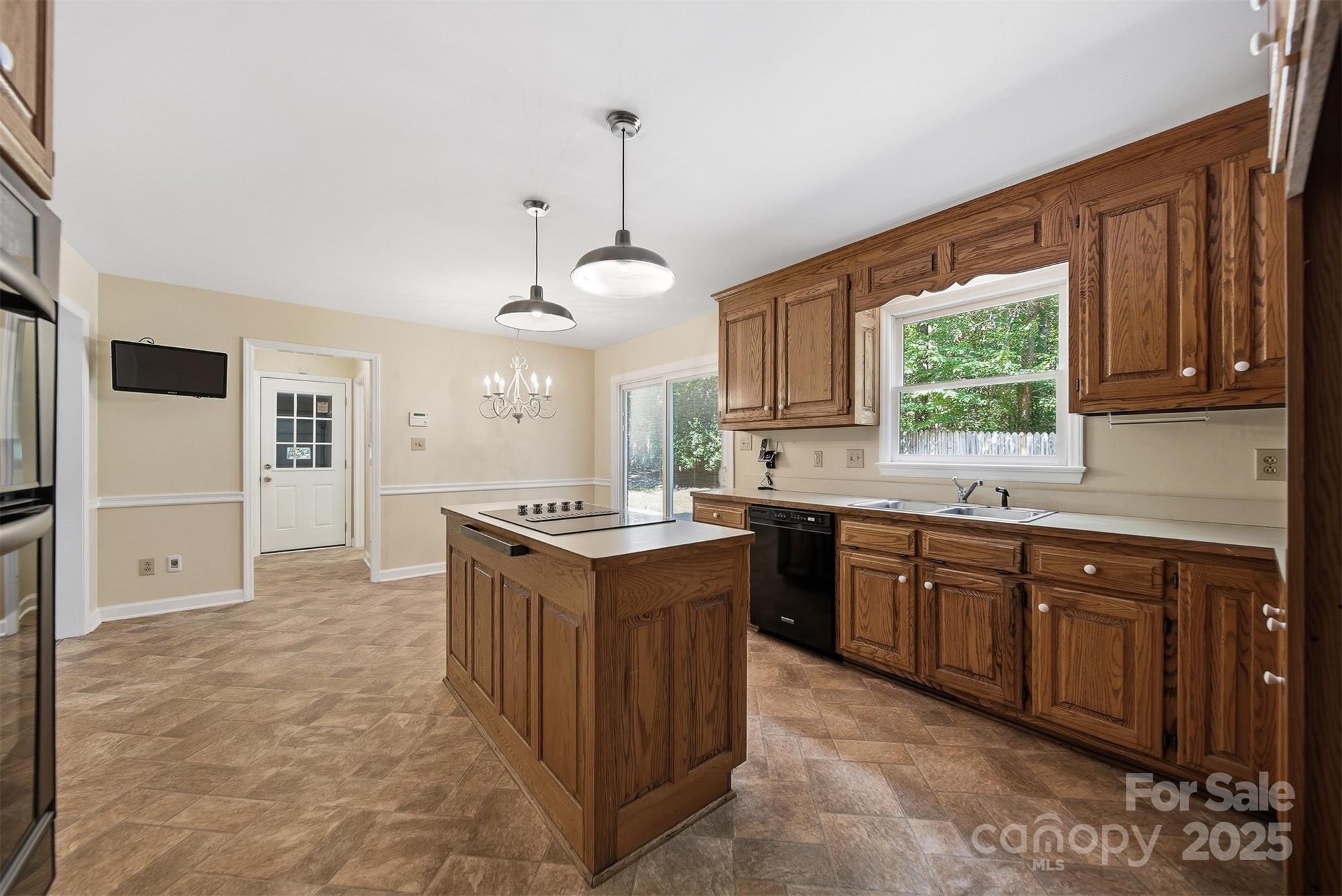 147 35th Avenue Northeast Hickory, NC 28601 - Photo 11 of 43 a kitchen with stainless steel appliances granite countertop a stove a sink dishwasher and a refrigerator