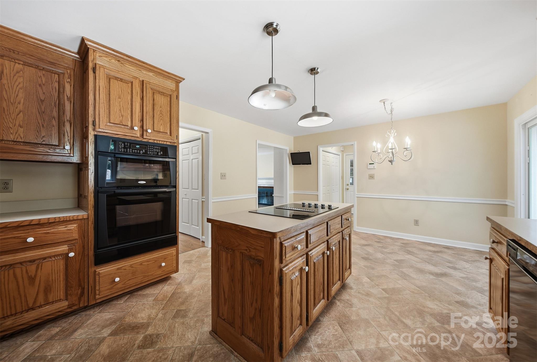 147 35th Avenue Northeast Hickory, NC 28601 - Photo 13 of 43 a kitchen with granite countertop a stove oven and a refrigerator