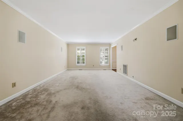 a view of empty room with windows