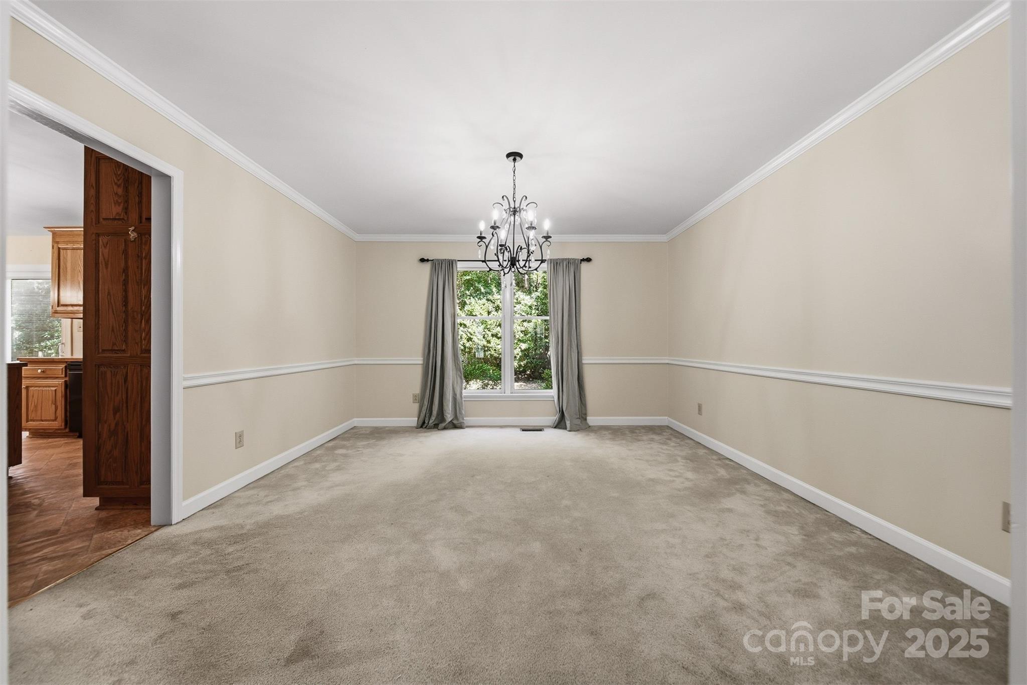 147 35th Avenue Northeast Hickory, NC 28601 - Photo 16 of 43 an empty room with windows and chandelier