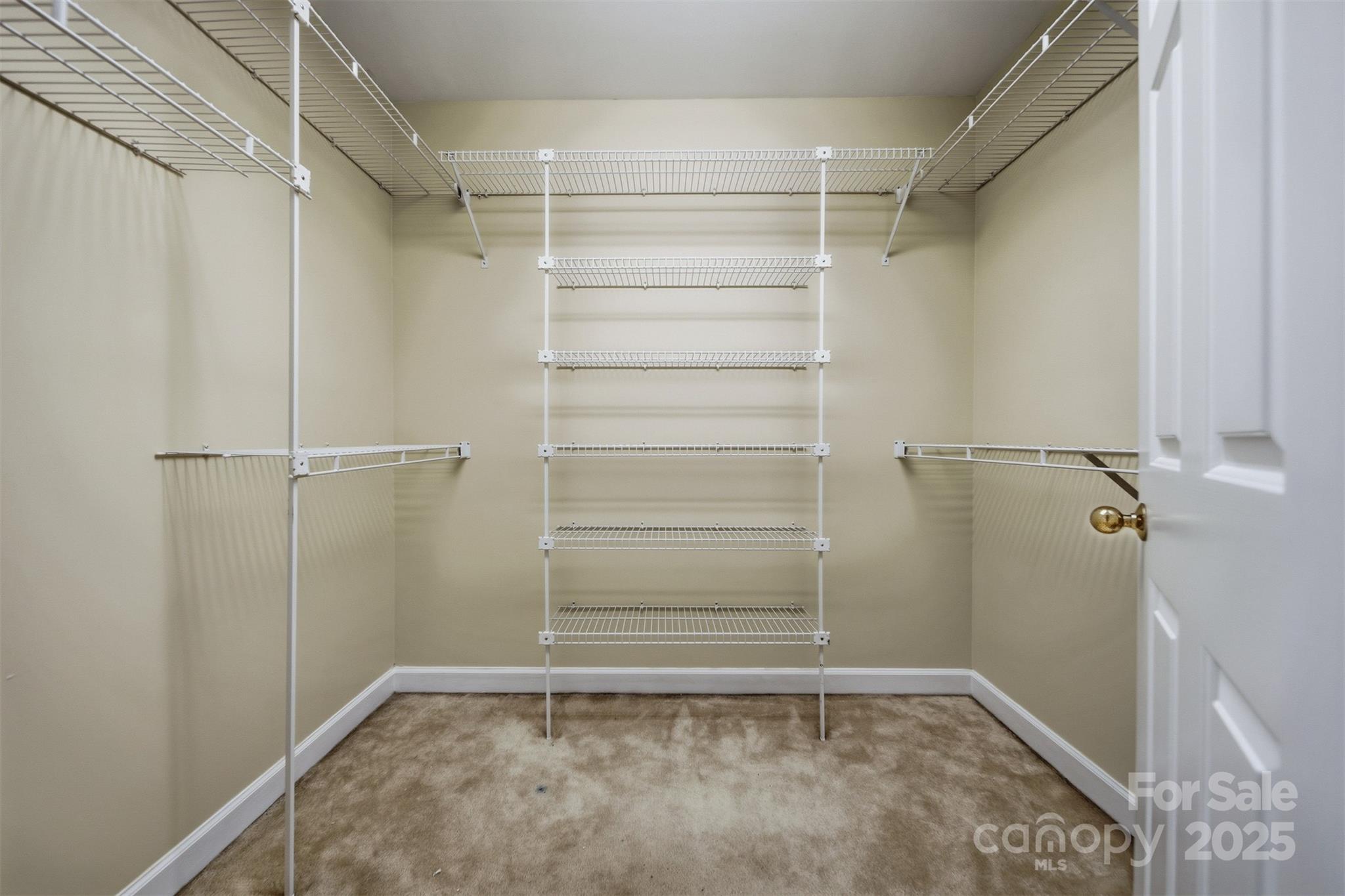147 35th Avenue Northeast Hickory, NC 28601 - Photo 25 of 43 a view of walk in closet with empty racks