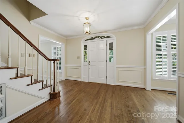 a view of an entryway with wooden floor