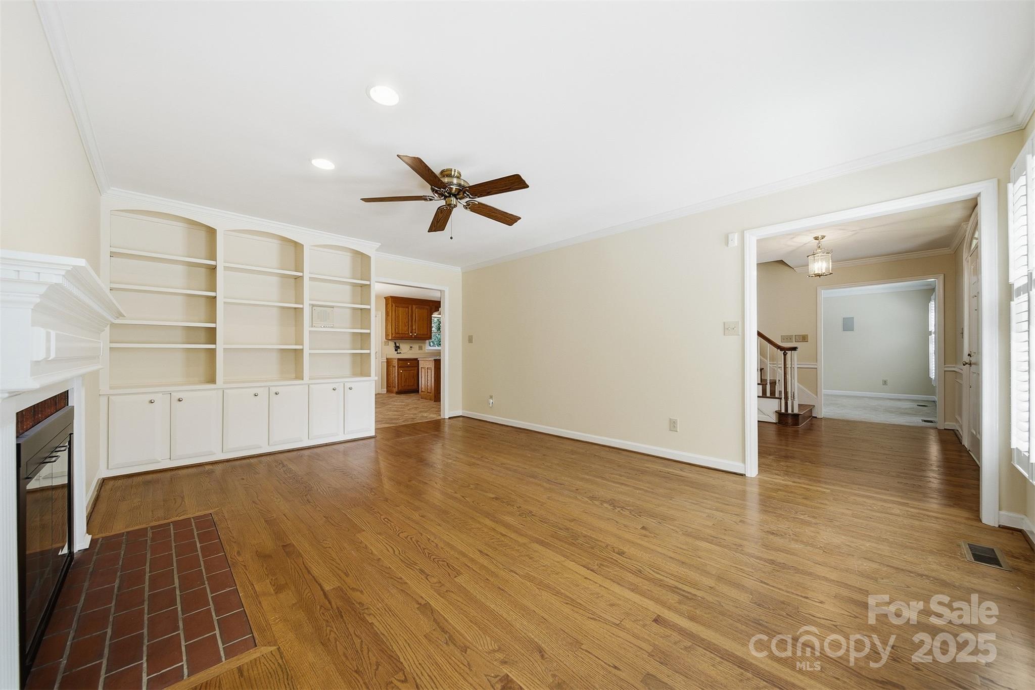 147 35th Avenue Northeast Hickory, NC 28601 - Photo 9 of 43 an empty room with wooden floor and windows