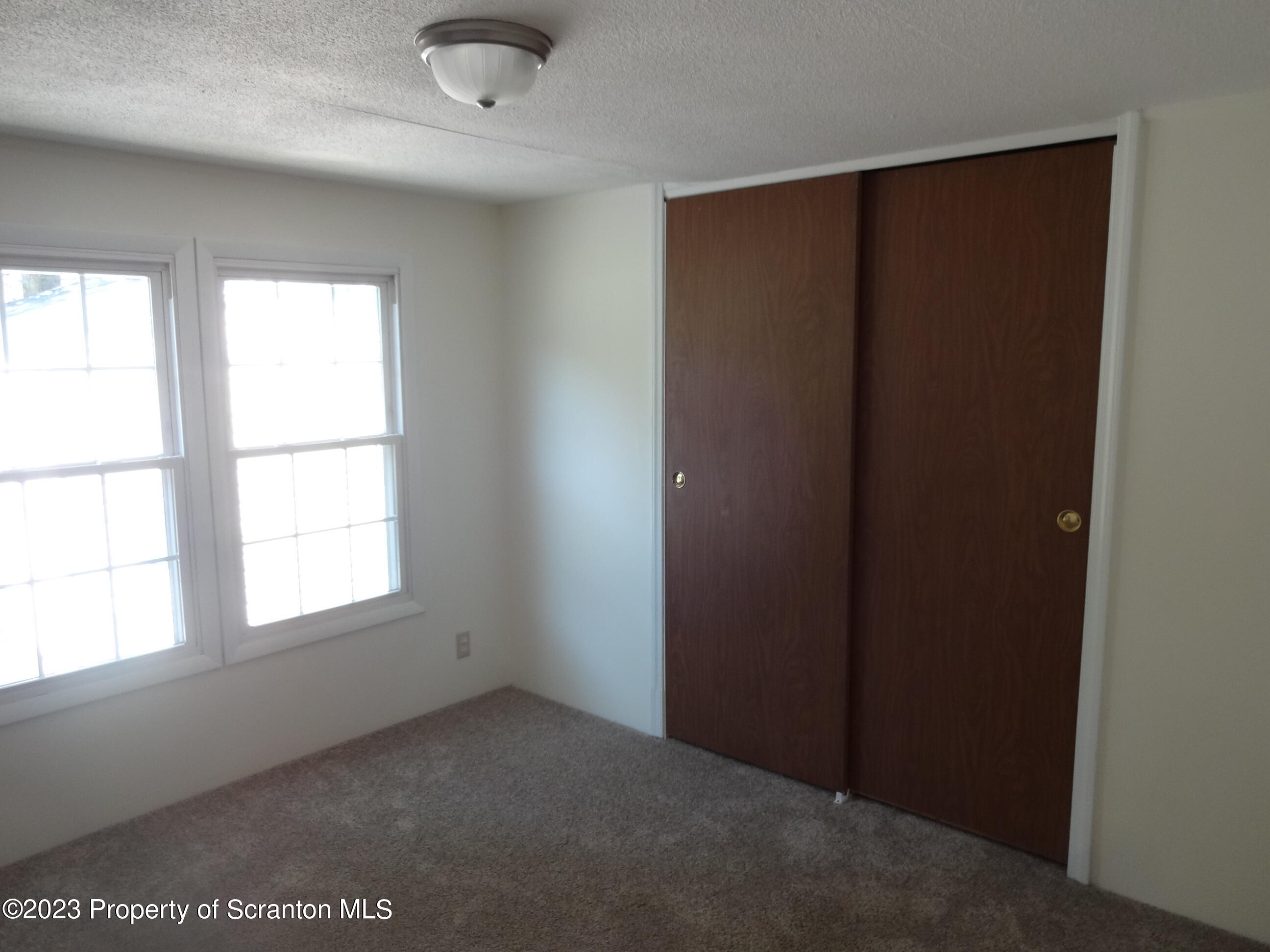10 Center Street Lake Ariel, PA 18436 - Photo 14 of 18 an empty room with a window