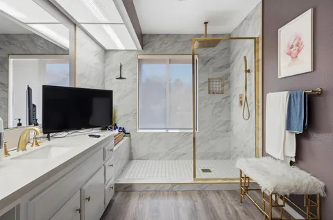 a bathroom with a double vanity sink and mirror