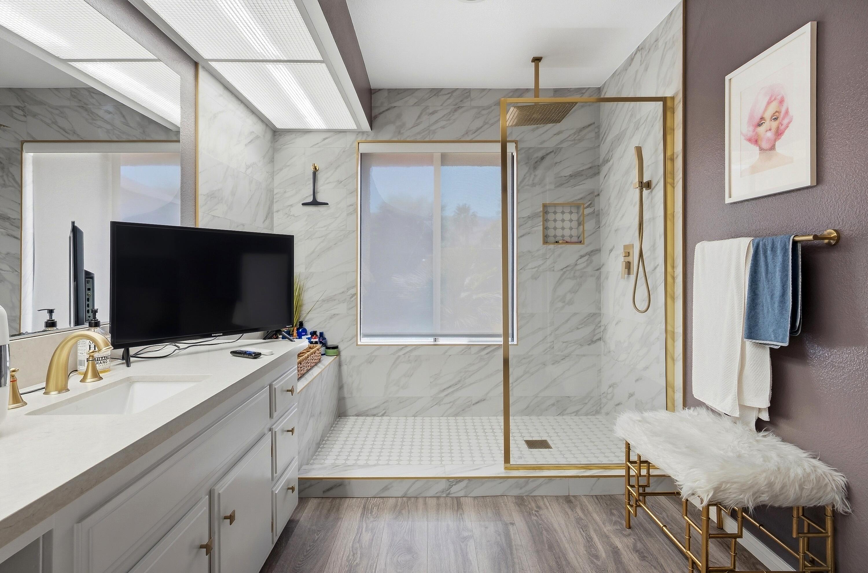 71870 Eleanora Lane Rancho Mirage, CA 92270 - Photo 15 of 36 a bathroom with a double vanity sink and mirror