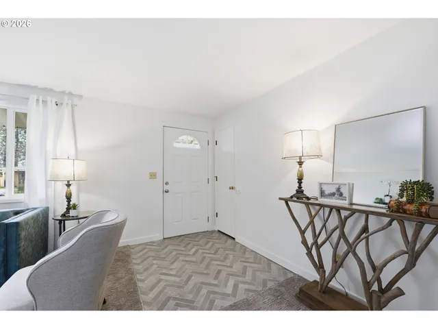 a view of an entryway with wooden floor