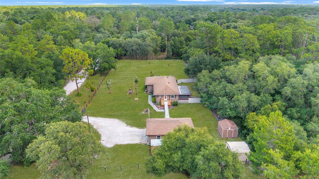 15755 Southwest 90th Avenue Dunnellon, FL 34432 - Photo 55 of 55 an aerial view of a house with a yard