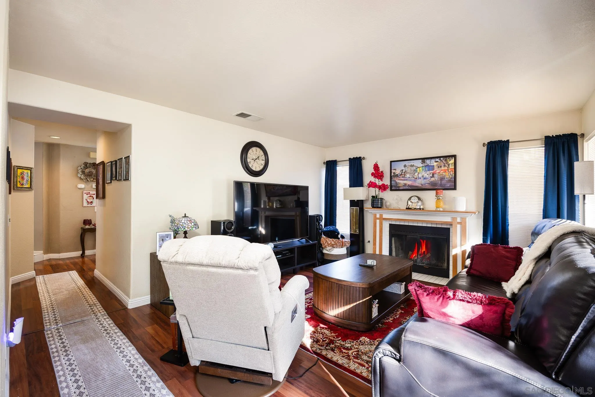 5063 Frazee Road Oceanside, CA 92057 - Photo 13 of 45 a living room with furniture and a fireplace