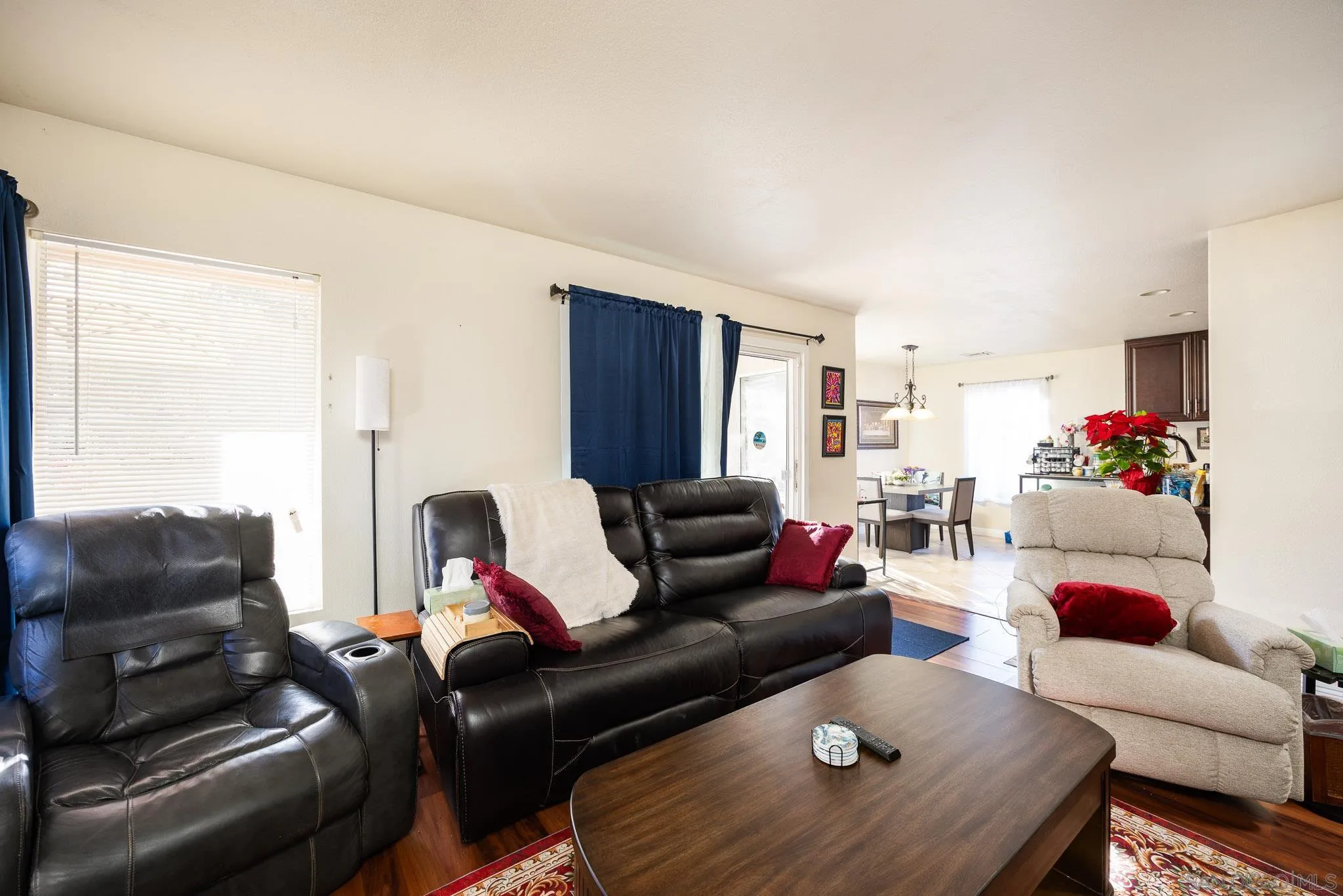5063 Frazee Road Oceanside, CA 92057 - Photo 15 of 45 a living room with furniture and a couch