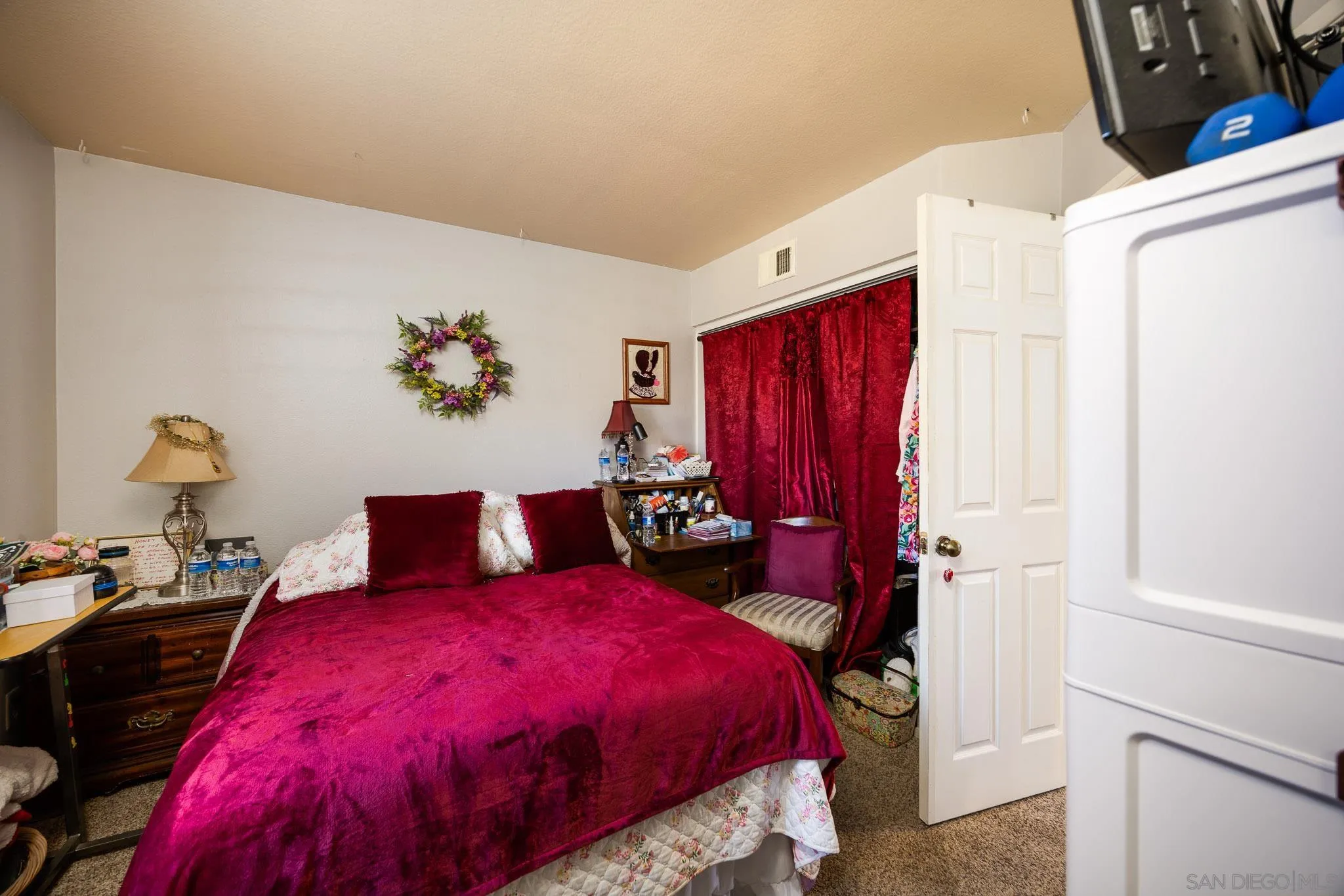 5063 Frazee Road Oceanside, CA 92057 - Photo 17 of 45 a bed room with a bed and a closet