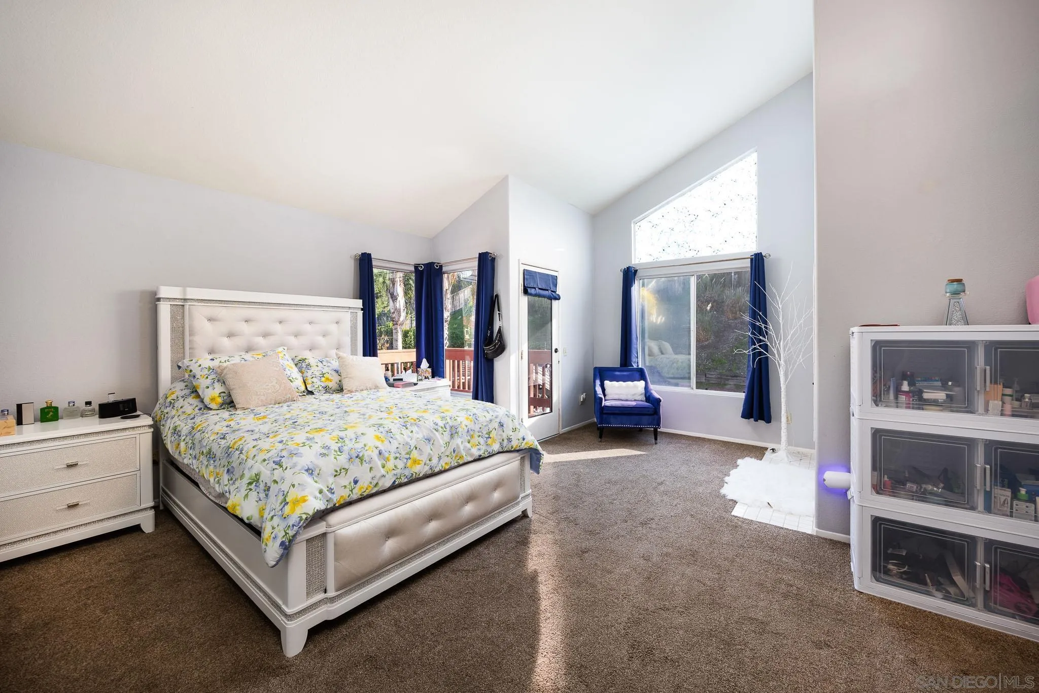 5063 Frazee Road Oceanside, CA 92057 - Photo 21 of 45 a bed room with a bed and a chair