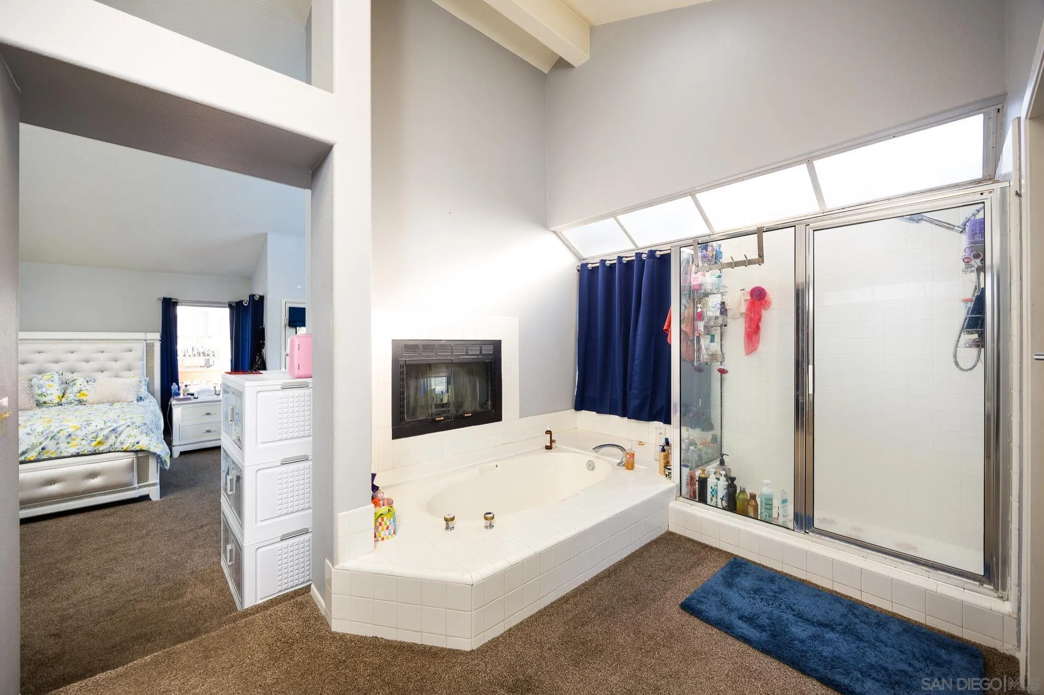 5063 Frazee Road Oceanside, CA 92057 - Photo 26 of 45 a view of a bedroom with furniture and window