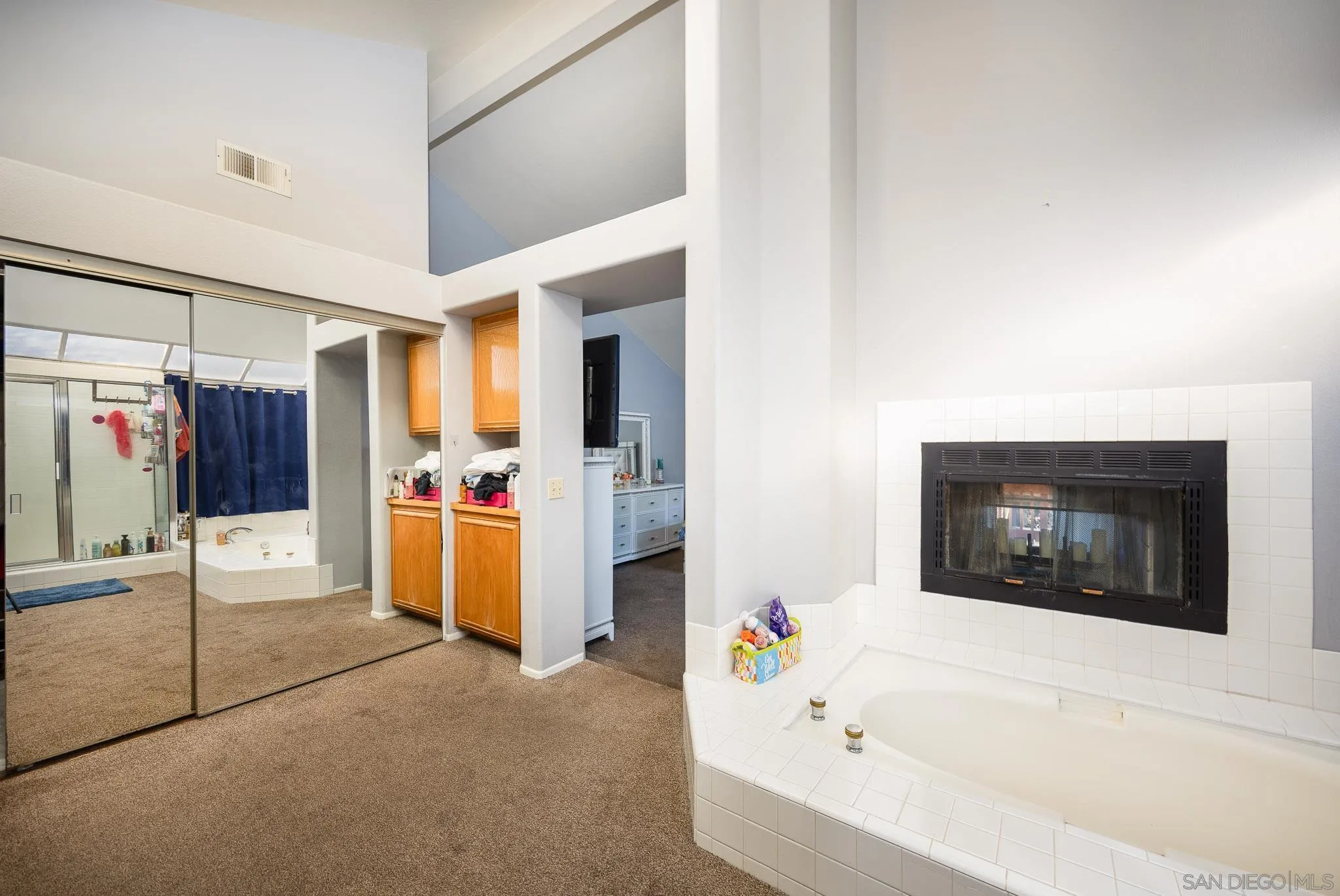 5063 Frazee Road Oceanside, CA 92057 - Photo 28 of 45 a bathroom with a bathtub and a shower