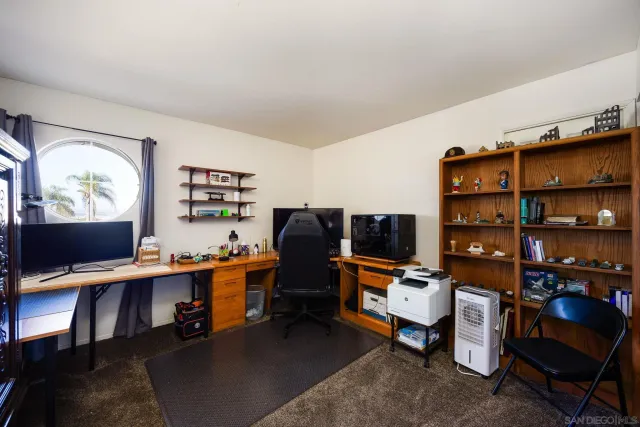 a view of a workspace with furniture