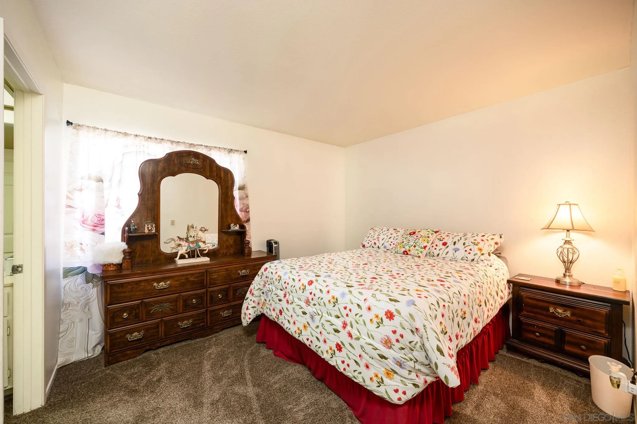 5063 Frazee Road Oceanside, CA 92057 - Photo 31 of 45 a bedroom with a bed and a dresser