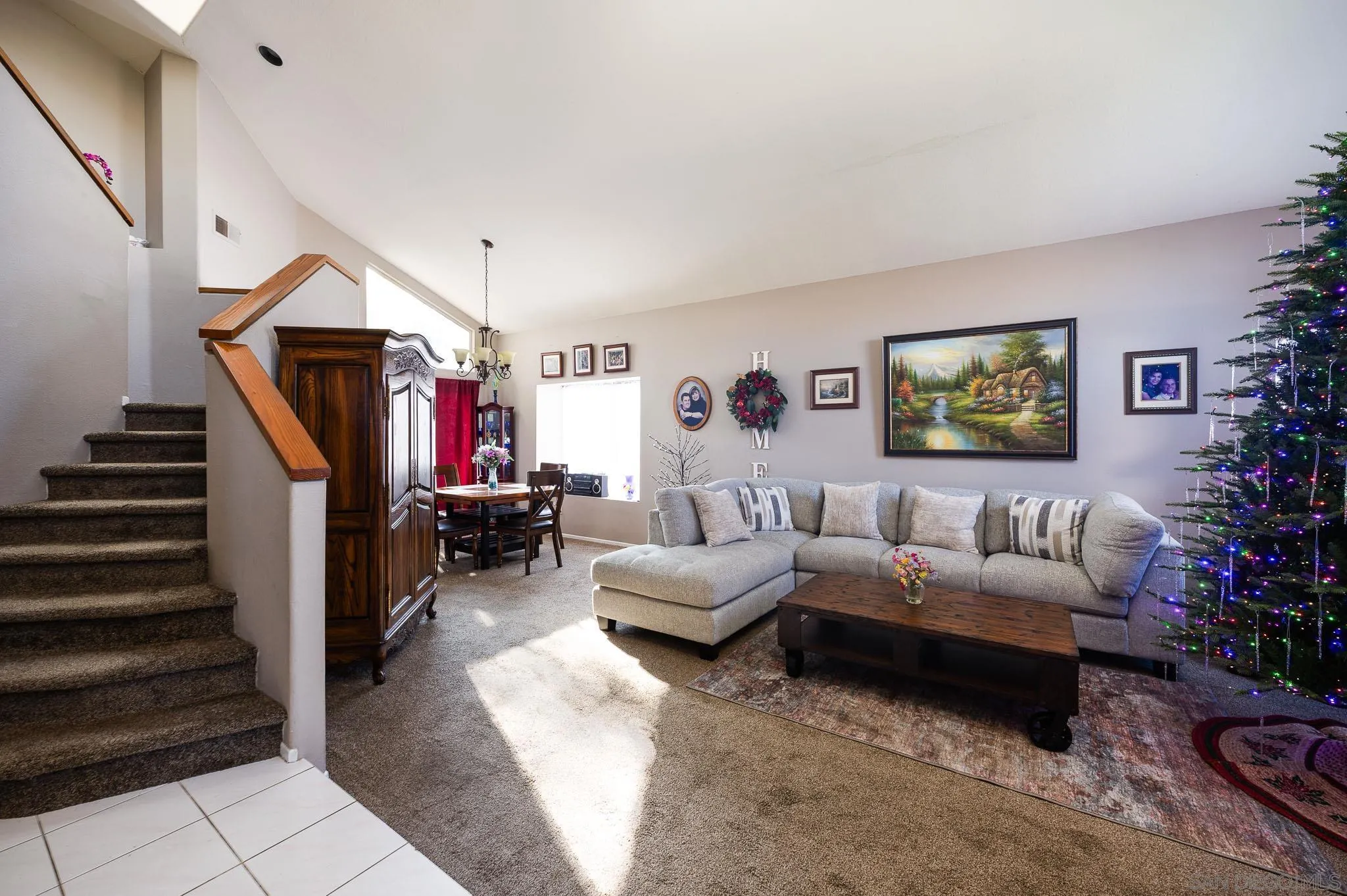 5063 Frazee Road Oceanside, CA 92057 - Photo 6 of 45 a living room with furniture and a ceiling fan