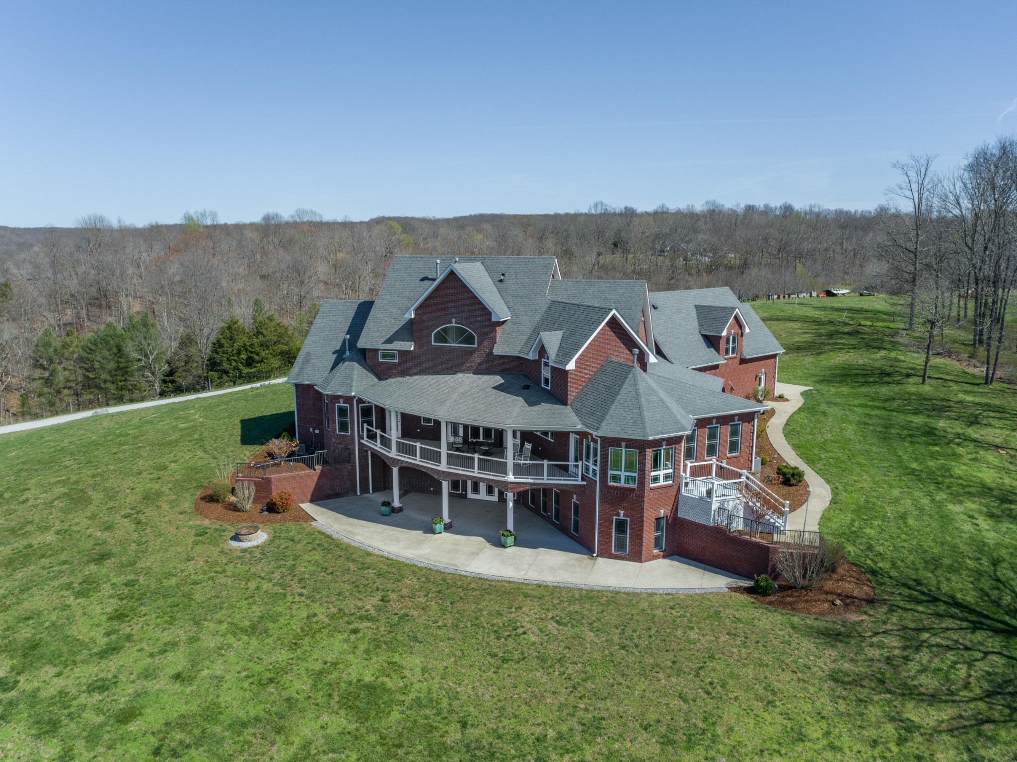 an aerial view of a house with swimming pool garden and mountain view