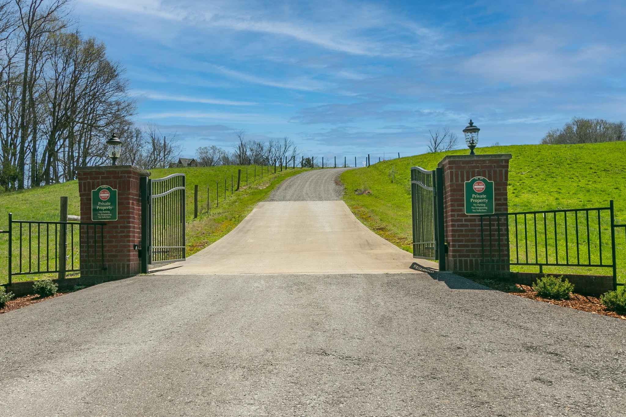2682 Maple Grove Road Dickson, TN 37055 - Photo 2 of 50 a view of a pathway with a wrought fence