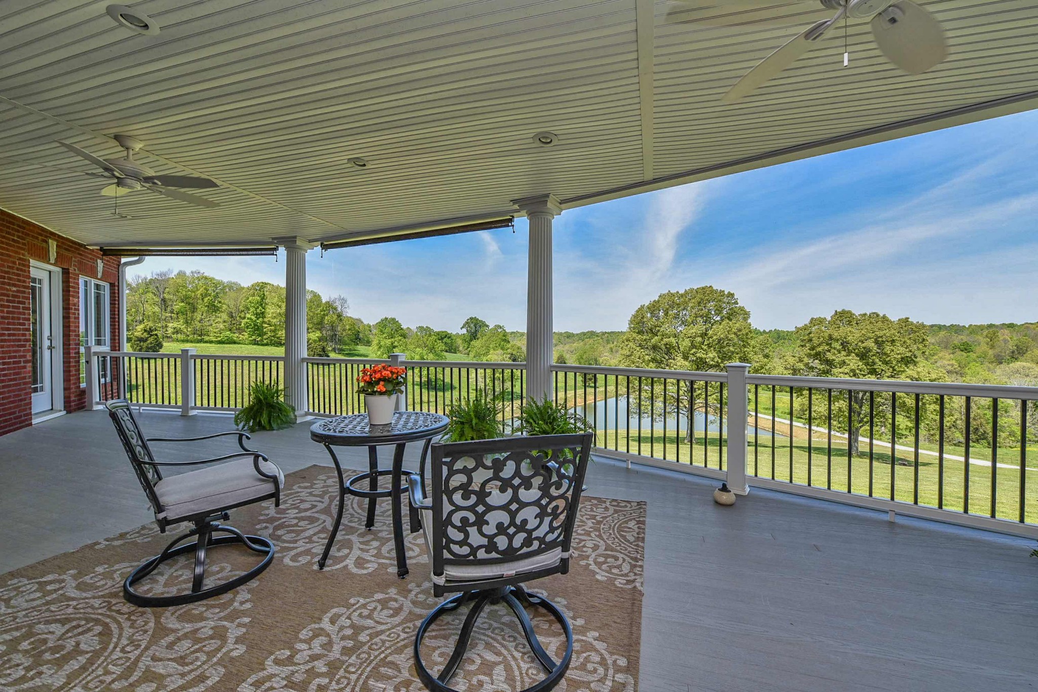 2682 Maple Grove Road Dickson, TN 37055 - Photo 11 of 50 a balcony with furniture and wooden floor