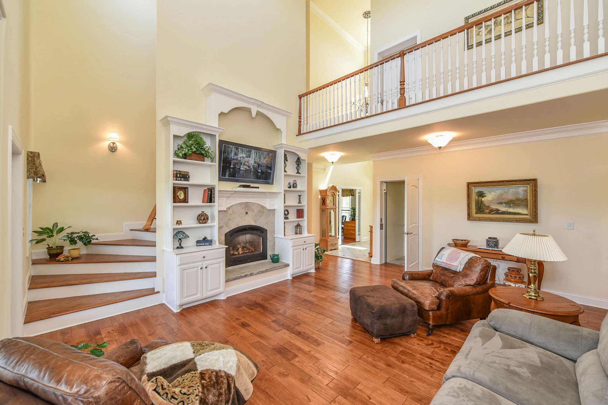 2682 Maple Grove Road Dickson, TN 37055 - Photo 12 of 50 a living room with furniture a fireplace and a flat screen tv
