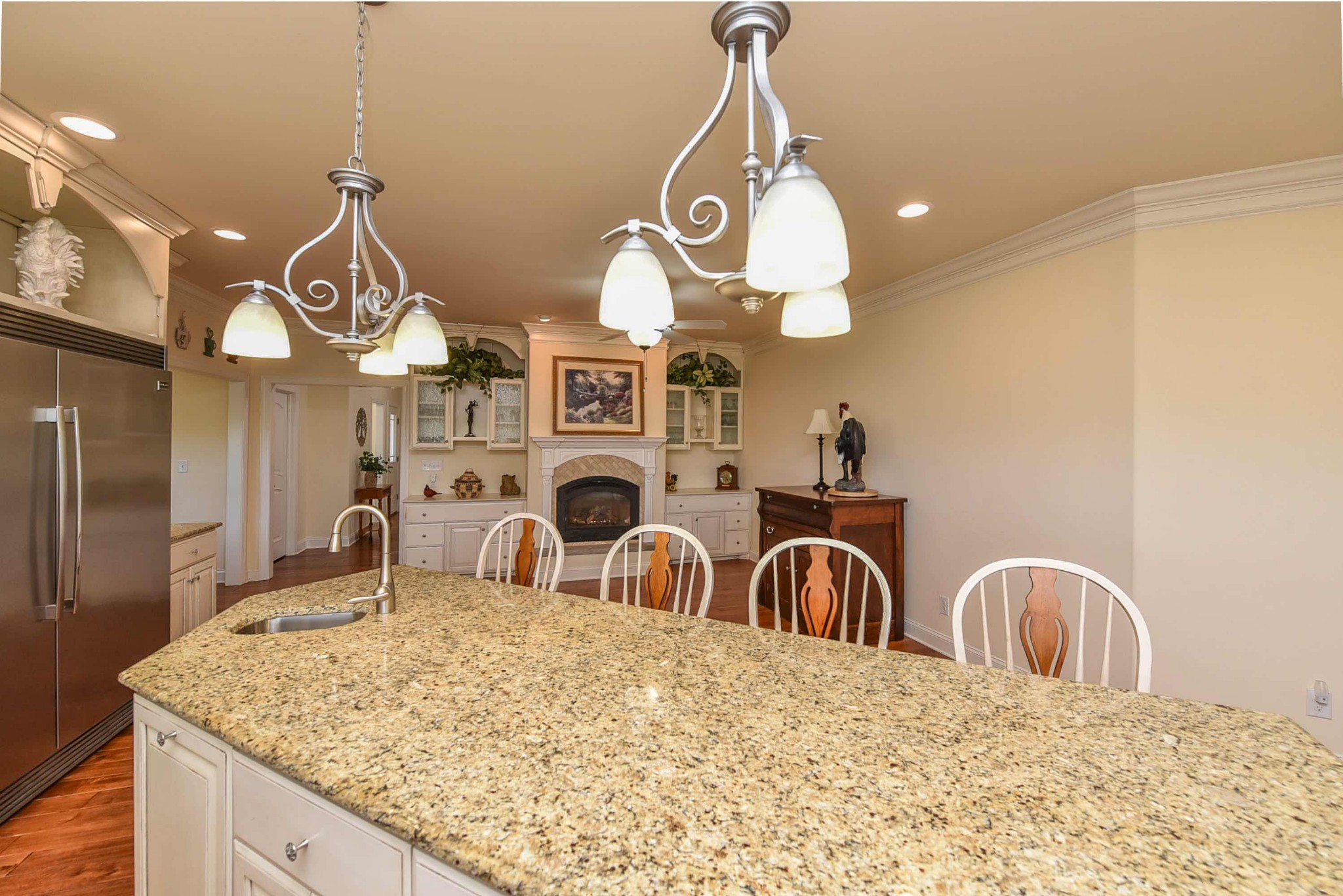 2682 Maple Grove Road Dickson, TN 37055 - Photo 16 of 50 a kitchen with kitchen island granite countertop a stove a sink a oven with a dining table and chairs