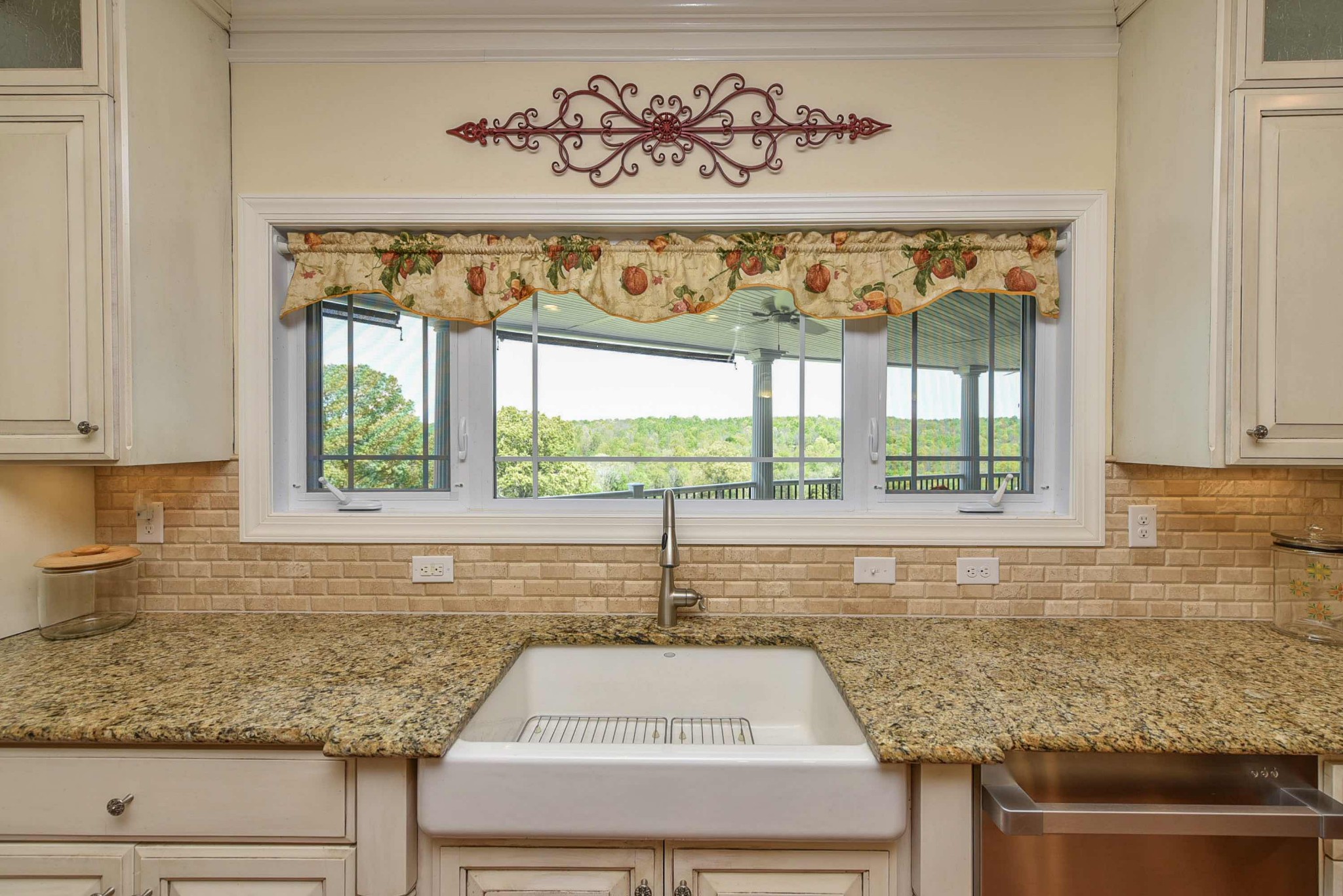 2682 Maple Grove Road Dickson, TN 37055 - Photo 17 of 50 a kitchen with kitchen island a counter top space and a large window