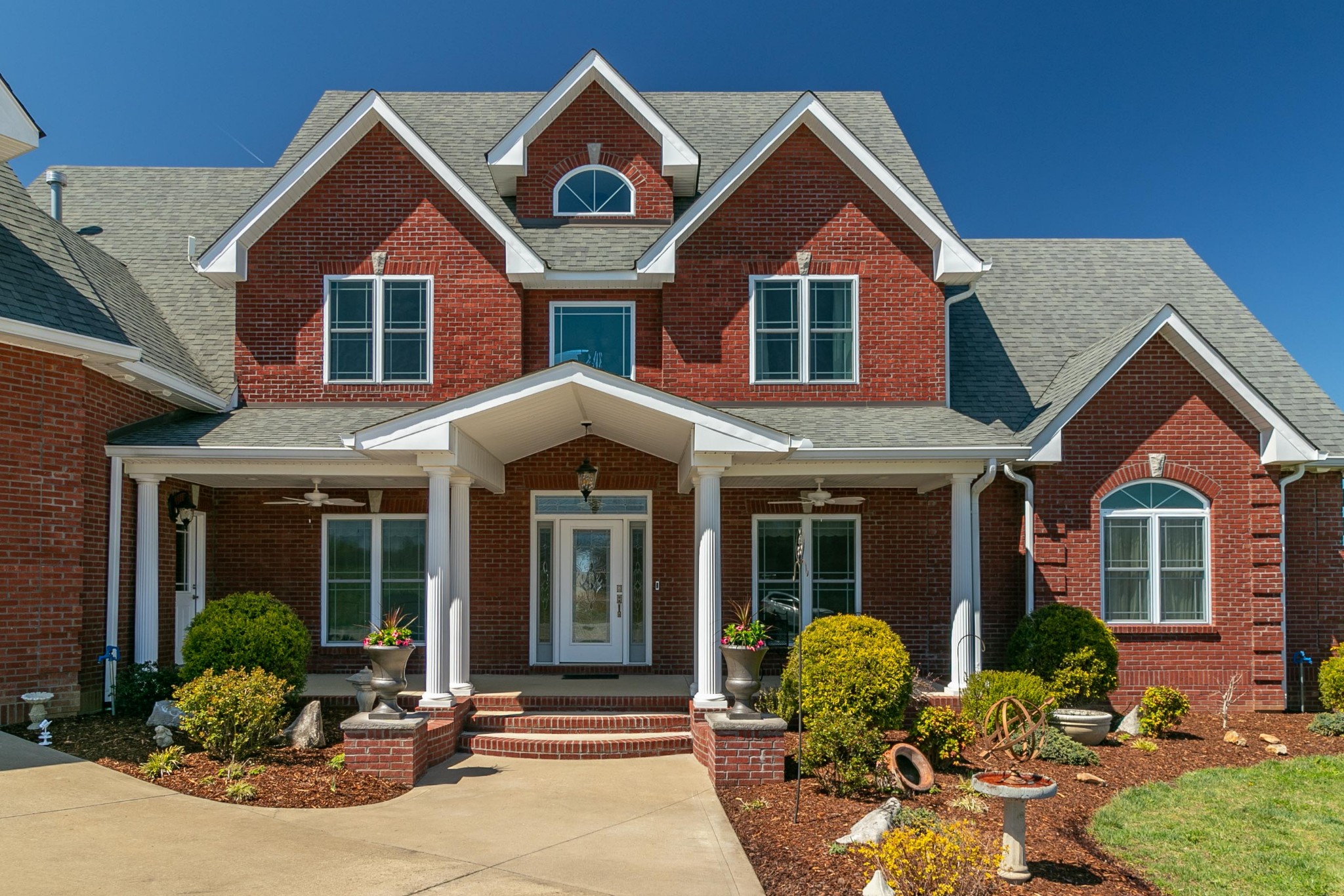 2682 Maple Grove Road Dickson, TN 37055 - Photo 3 of 50 a front view of a house with yard and outdoor seating