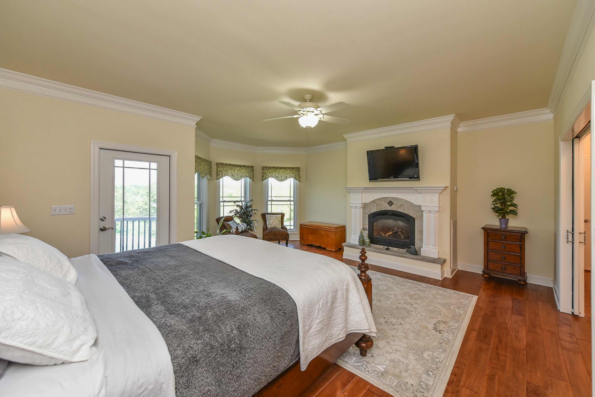 2682 Maple Grove Road Dickson, TN 37055 - Photo 22 of 50 a spacious bedroom with a bed and a fireplace