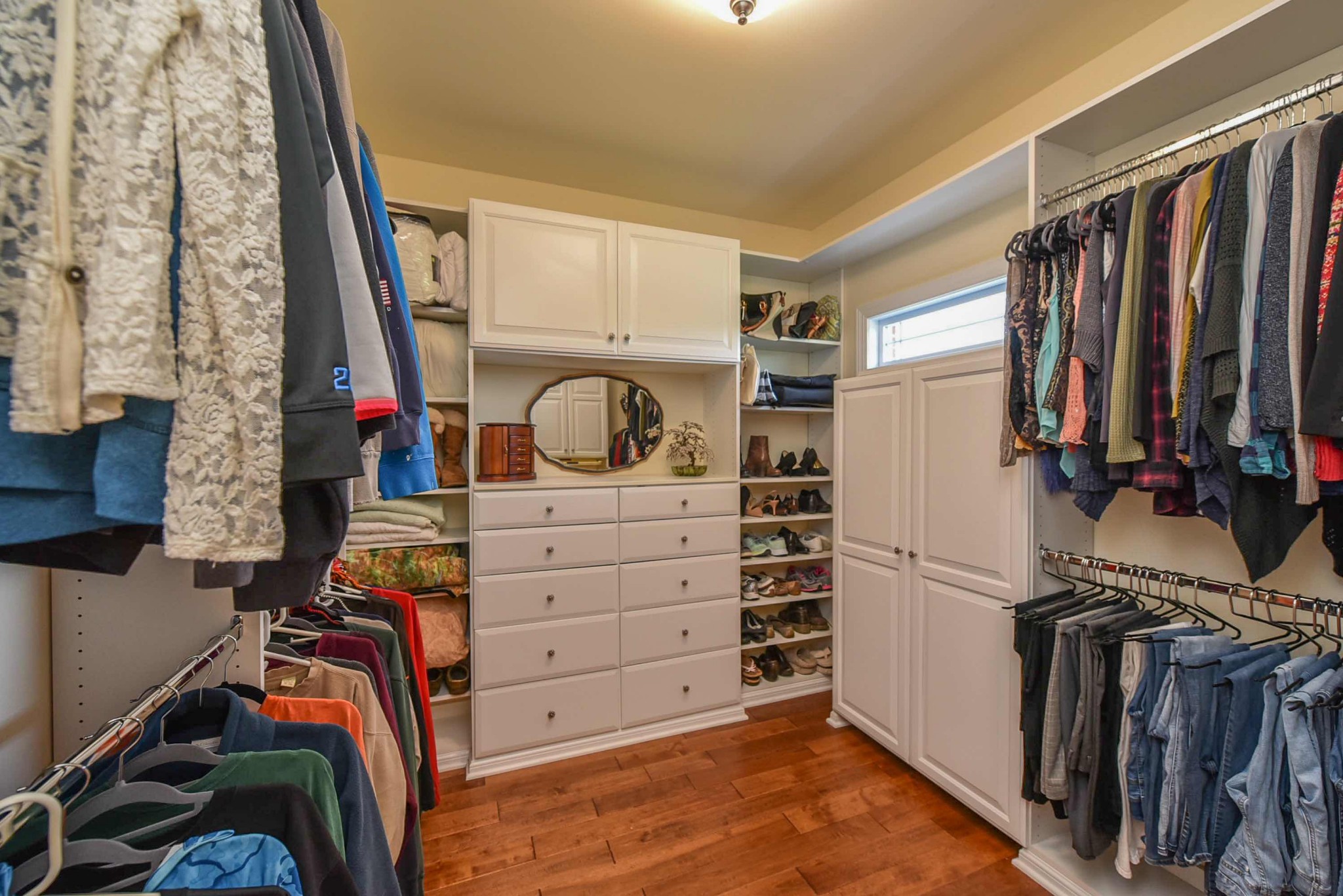 2682 Maple Grove Road Dickson, TN 37055 - Photo 27 of 50 a view of walk in closet with clothes and shoes