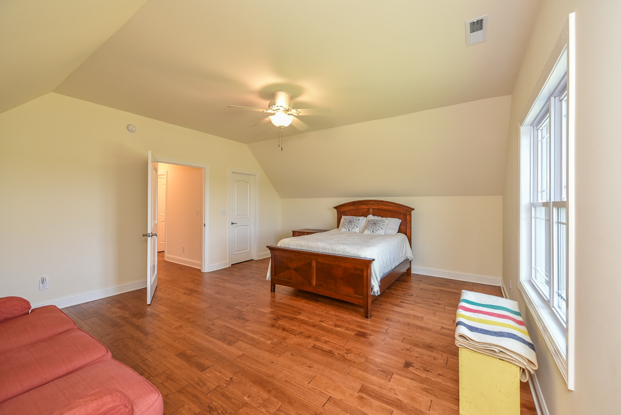 2682 Maple Grove Road Dickson, TN 37055 - Photo 42 of 50 a spacious bedroom with a bed and a chandelier