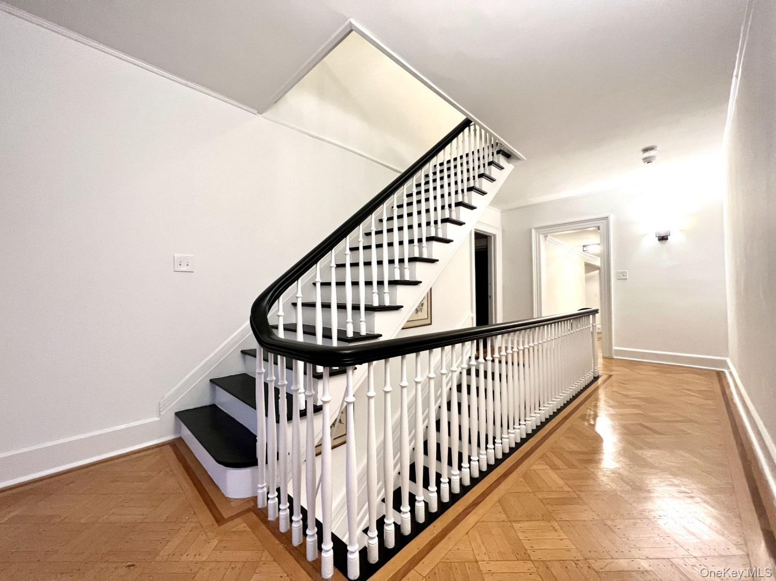 87 Wheatley Road Old Westbury, NY 11568 - Photo 14 of 16 Staircase with baseboards