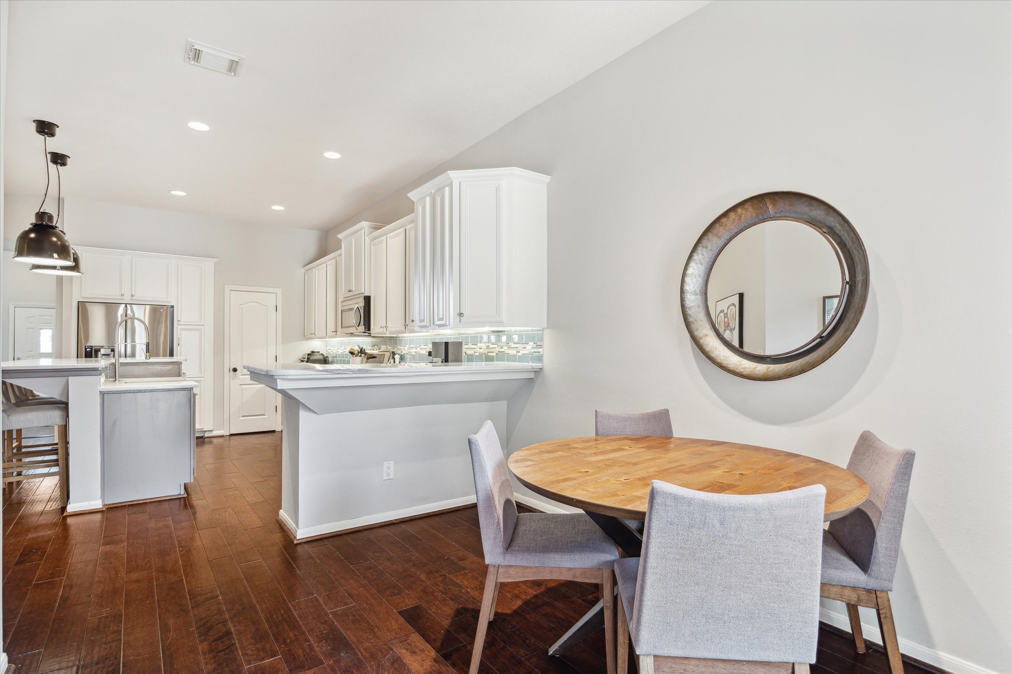 3310 Spring Landing Lane Pearland, TX 77584 - Photo 18 of 32 Light-filled breakfast/dining area with easy access to kitchen and main living spaces—great space daily use or rearrange your spaces and use this area as a study.
