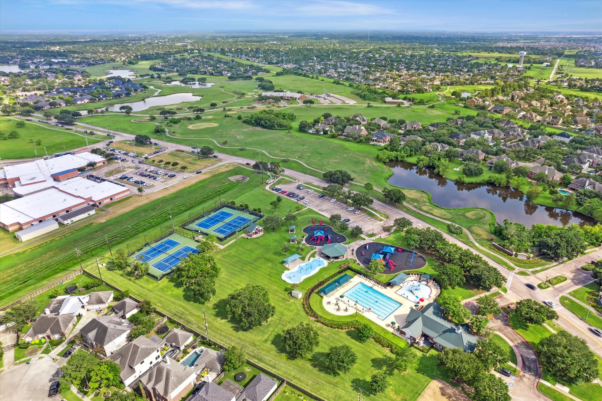 3310 Spring Landing Lane Pearland, TX 77584 - Photo 26 of 32 Aerial highlighting nearby community amenities are accessible to this community (pool, splash pad, pickle ball & tennis courts shown)