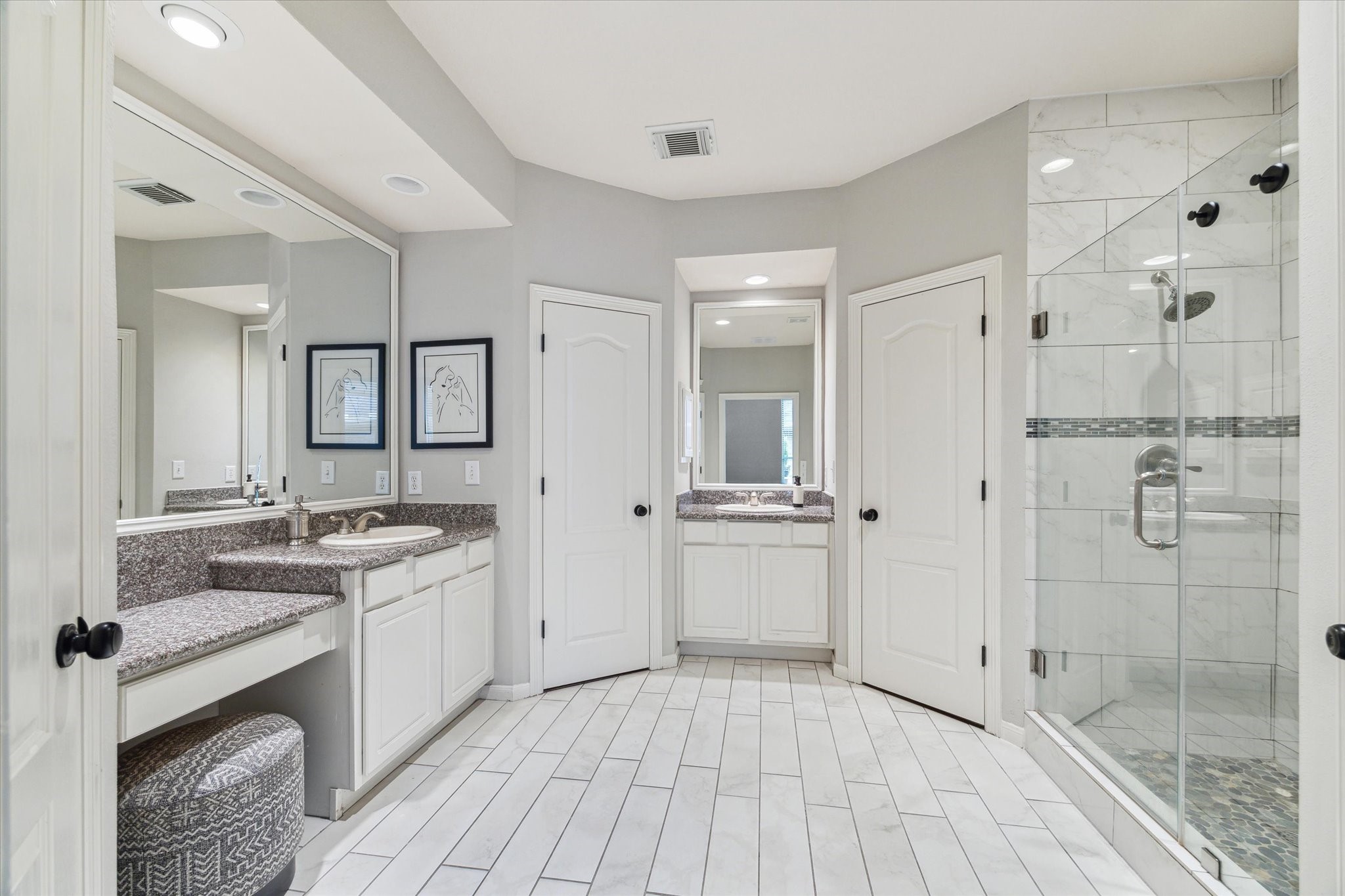 3310 Spring Landing Lane Pearland, TX 77584 - Photo 8 of 32 Spacious Primary bath with upgrades including flooring, shower tile, sleek glass enclosure, and modern hardware.