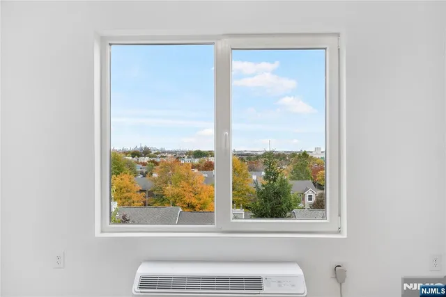 a view of a small space with a large window