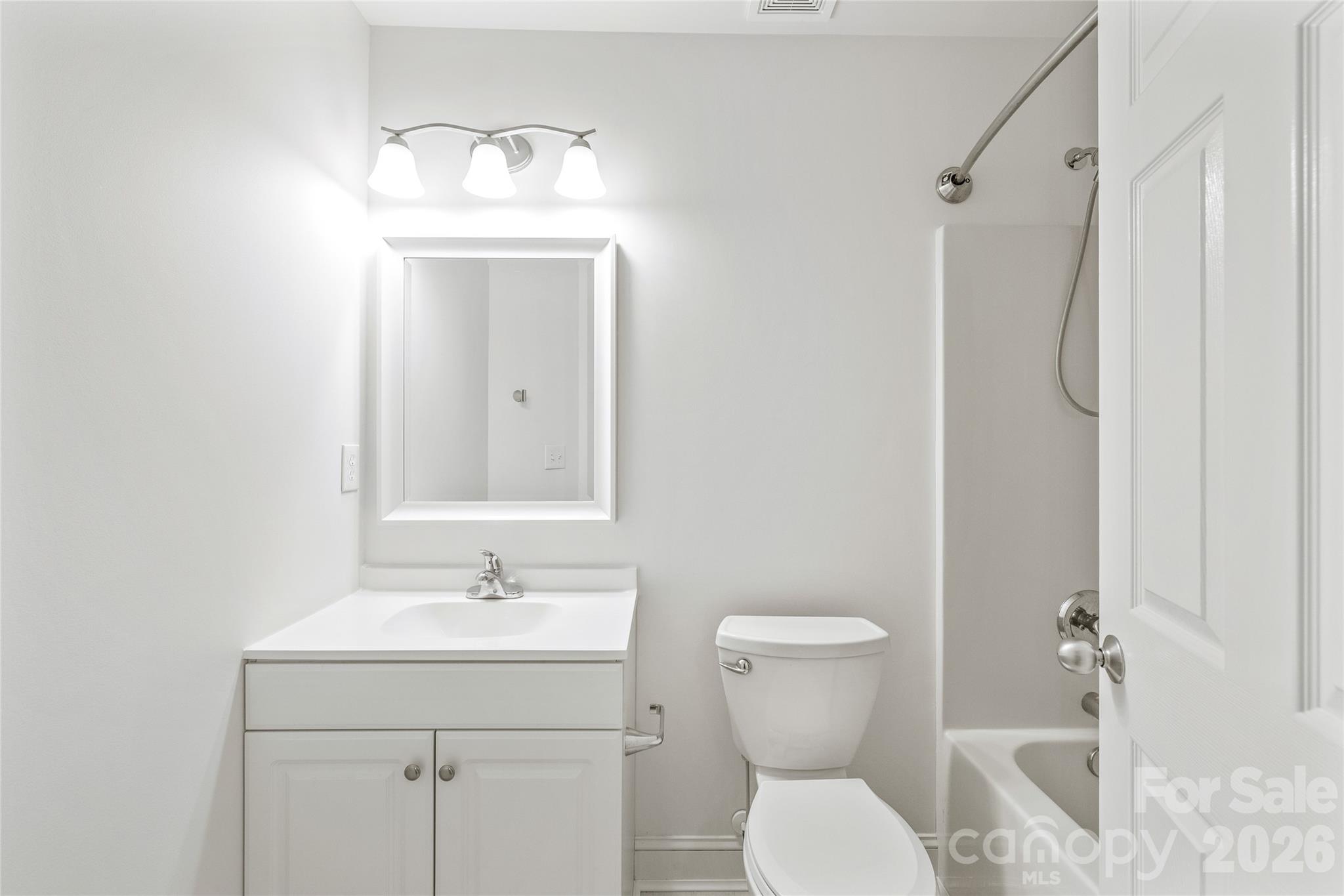 1707 Kashmir White Lane Fort Mill, SC 29708 - Photo 29 of 33 a bathroom with a toilet sink and mirror