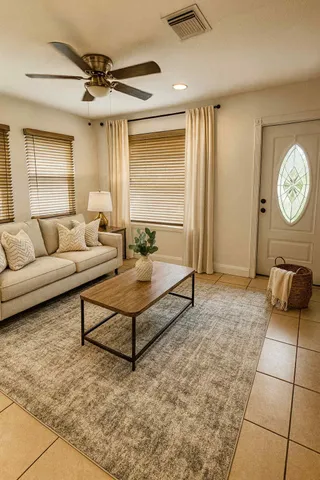 a living room with furniture and a window