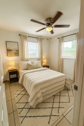 a bedroom with a bed and a window