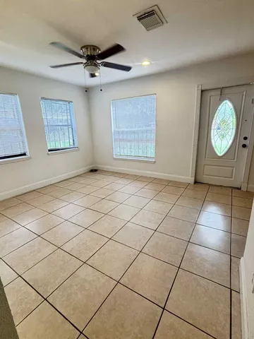 a view of an empty room and window