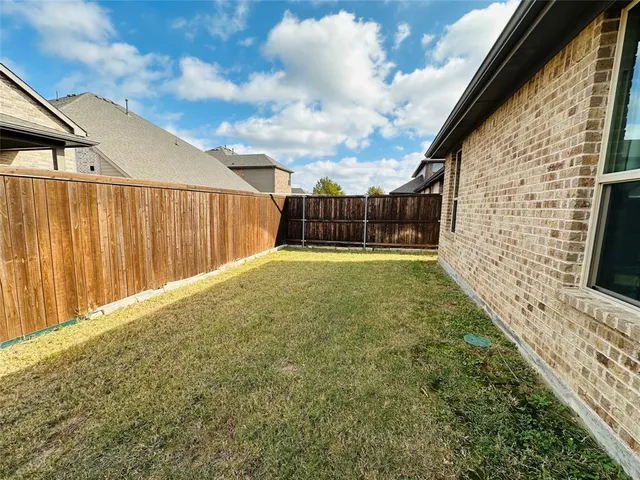 a view of balcony with yard